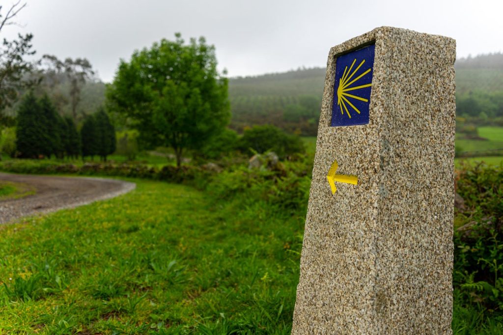 Sobre Nosotros A tranquil scene of a waymark on the Camino de Santiago walking route.